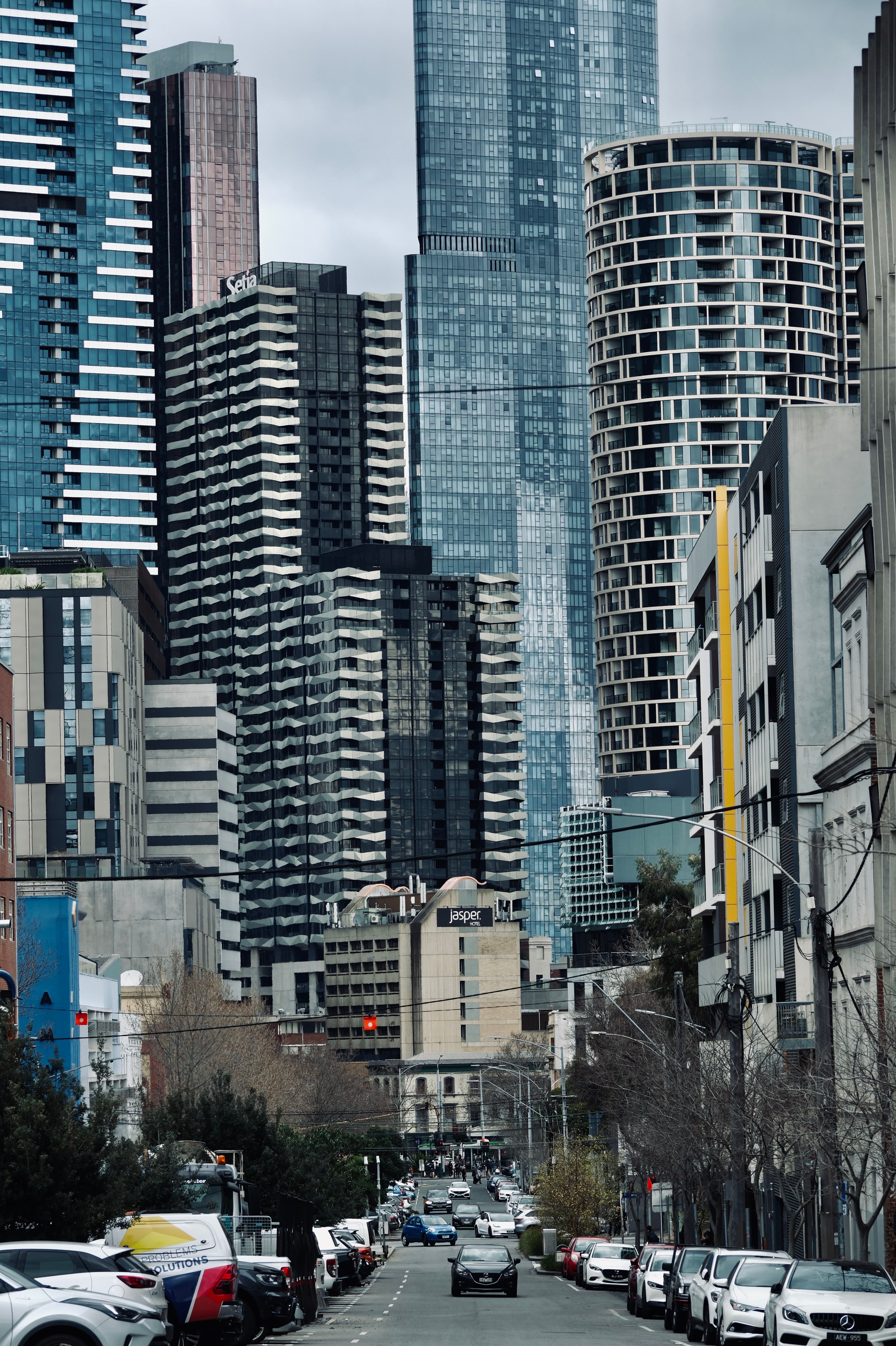 Looking down a Melbourne city street toward office towers